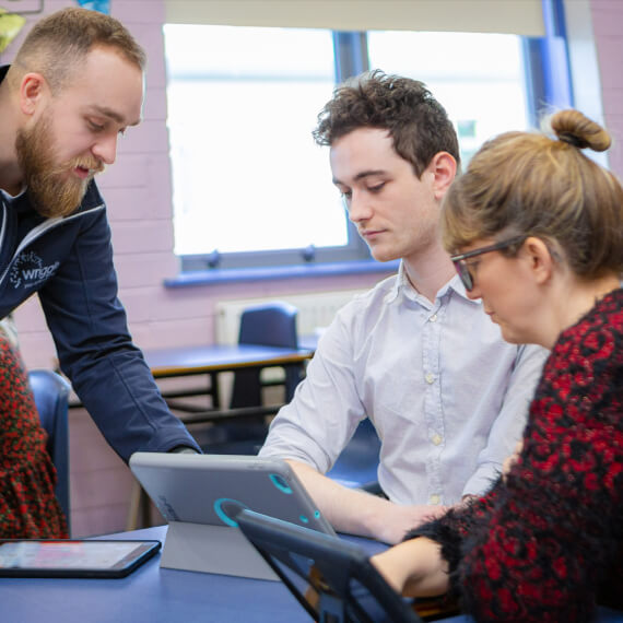 a teacher helping other teachers in the classroom