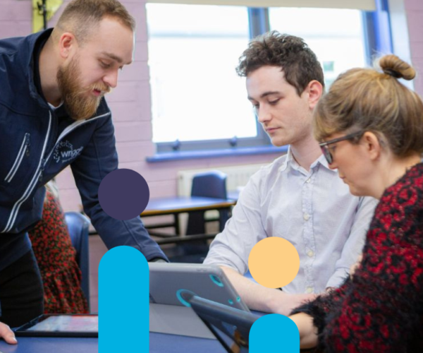 a teacher showing other teachers how to use an ipad in class