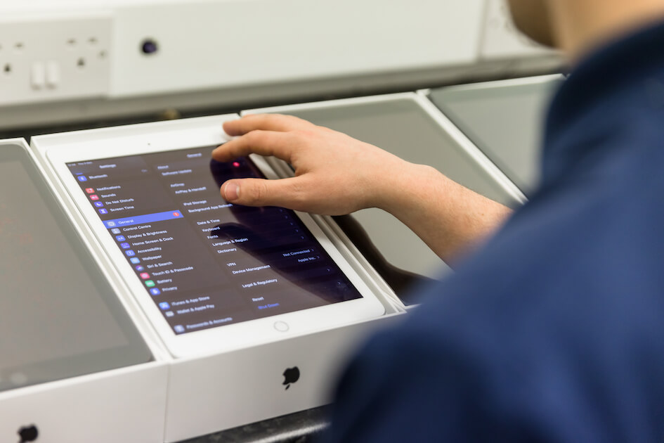 an engineer setting up an ipad