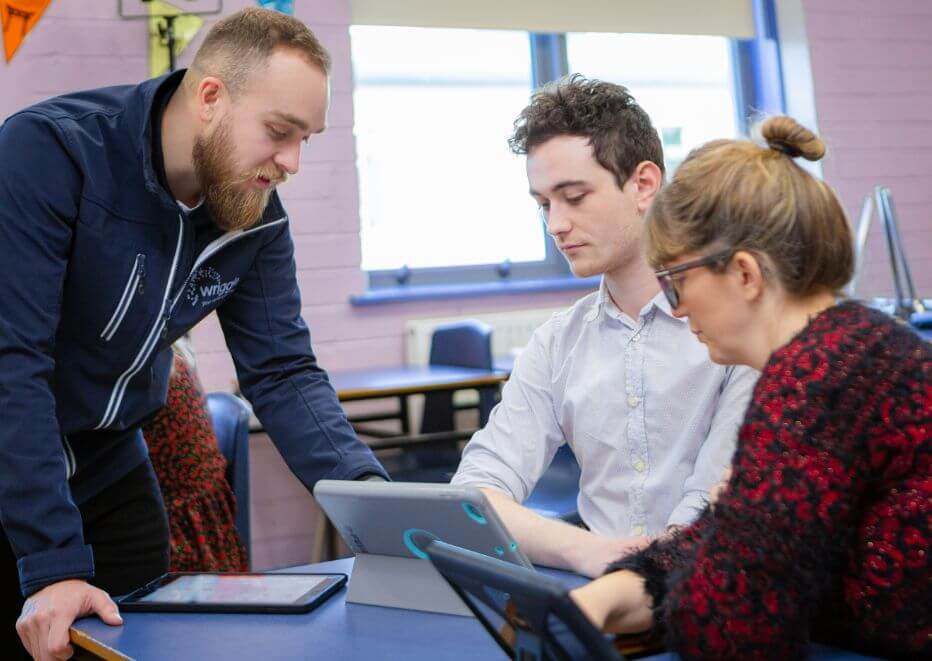 a teacher helping other teachers in the classroom