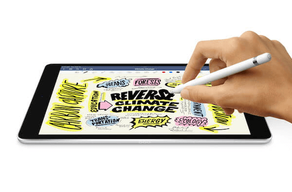 a hand writing on a tablet device