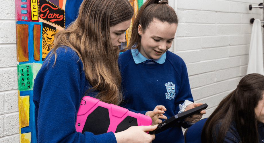 Students looking at devices