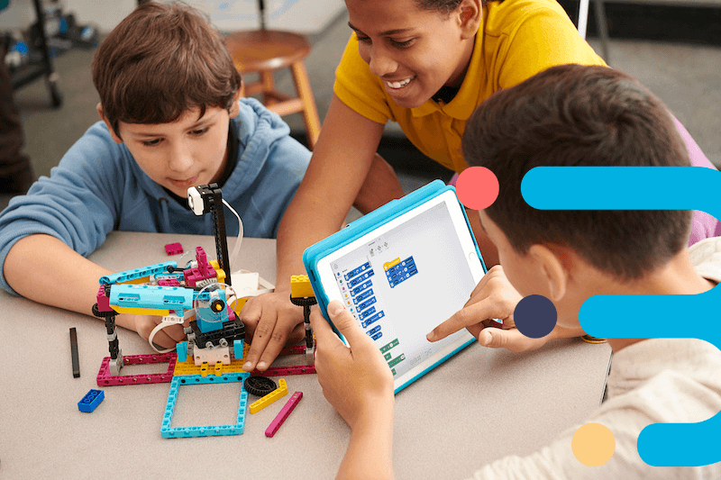 Students using lego and tablets in school