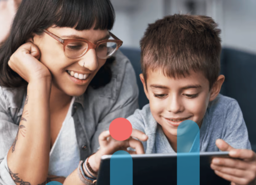 A Parent Helping Their Child With A Tablet Device