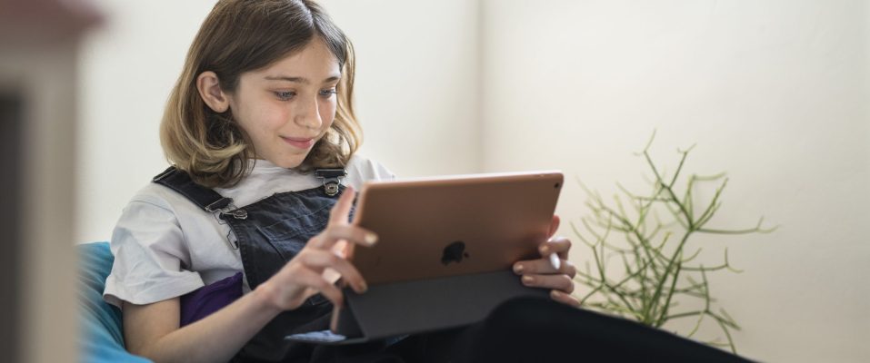 A student using iPad at home