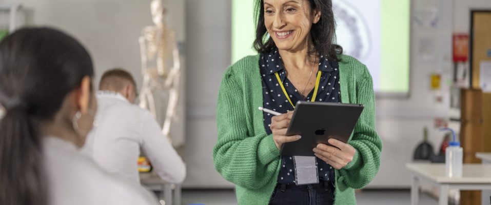 a teacher using ipad in class